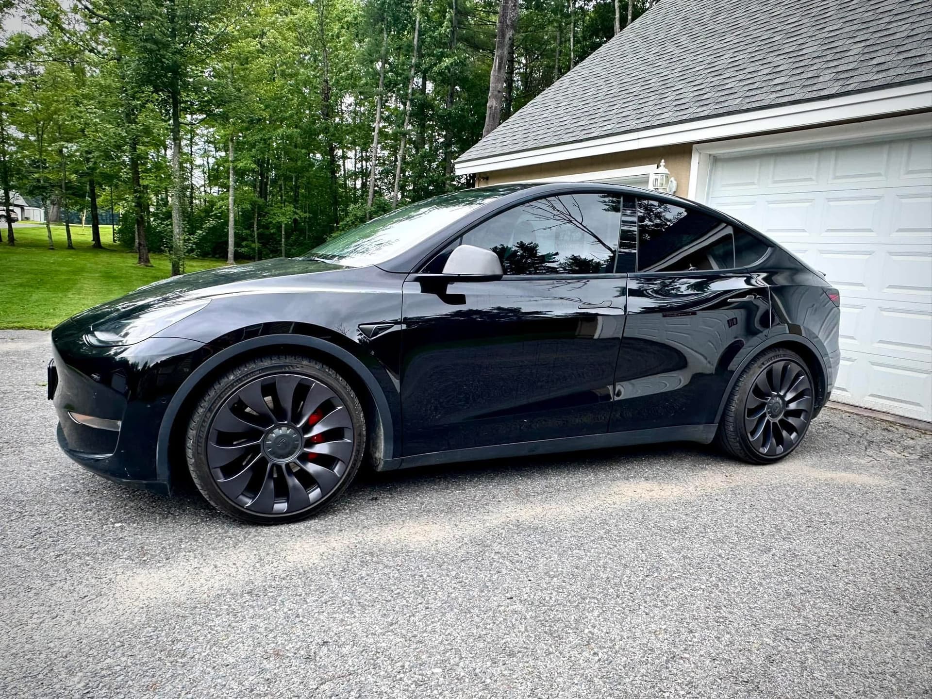 Black Tesla with ceramic window tint installed by The Mad Tinter in Maine